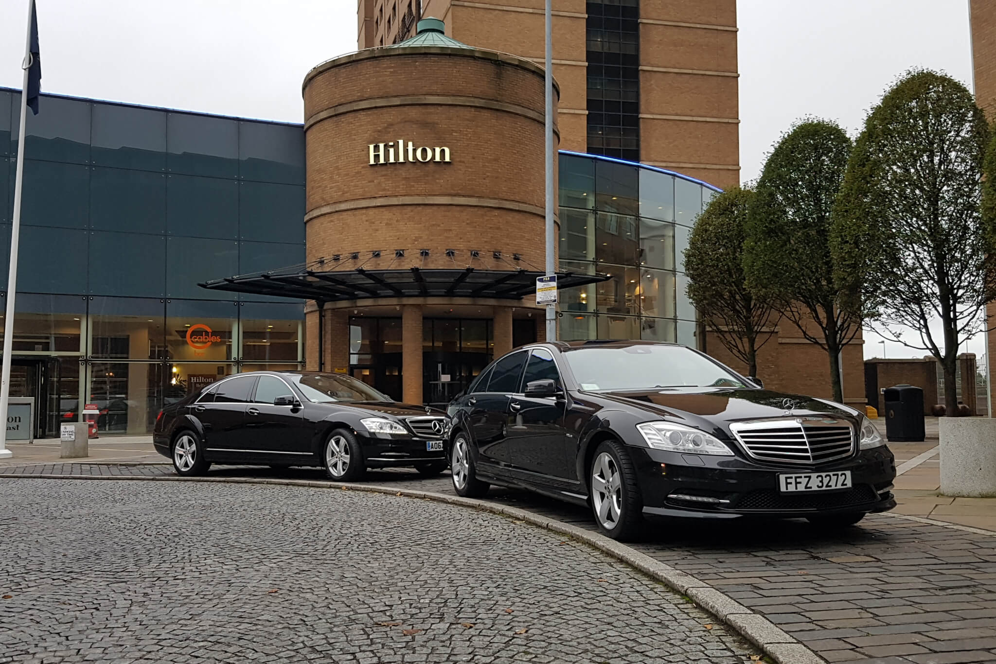 2 Mercedes parked at the Hilton Hotel